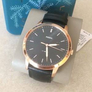 Unisex Fossil watch with dark brown leather band.